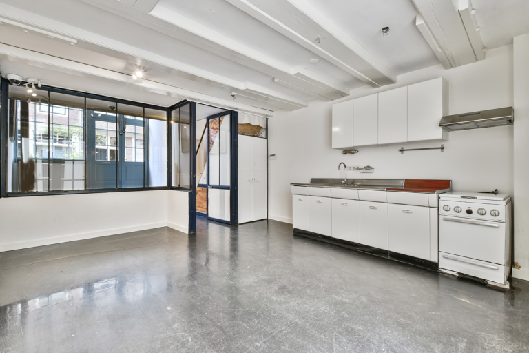 Bright Open Kitchen Interior With Concrete Floor
